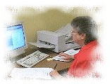 Employee working at scanning computer